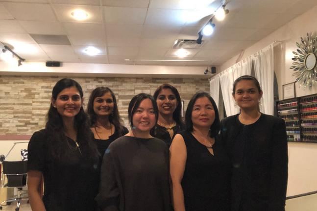 The Joy Spa & Nail team standing together inside the salon